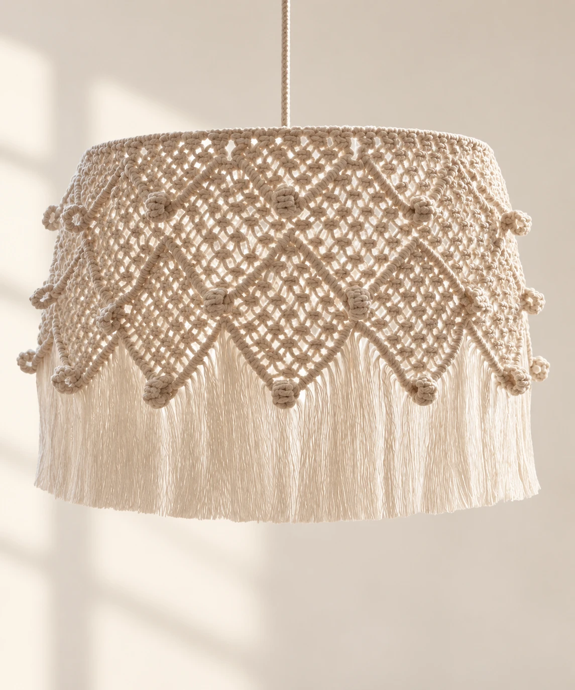 Close view of the lampshade knotwork and fringe